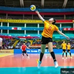 Home 22 배구 경기에서의 중요한 순간 - A dynamic volleyball match scene capturing a Vietnamese national team player executing a spectacular...